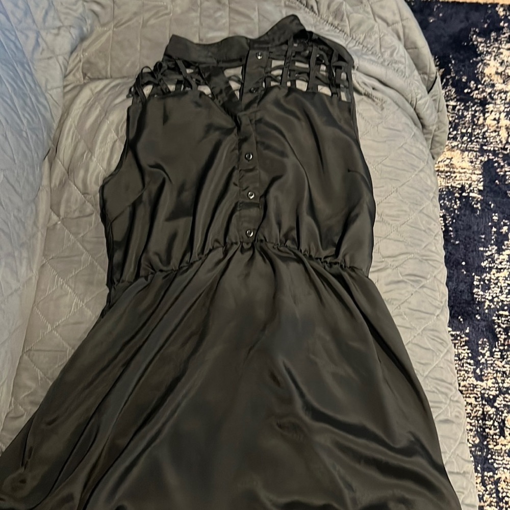 Women’s Forever 22 dress black silky size L with open design on the front.